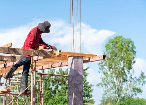 A construction worker is performing welding work on a steel beam at a build.. Stock Photos