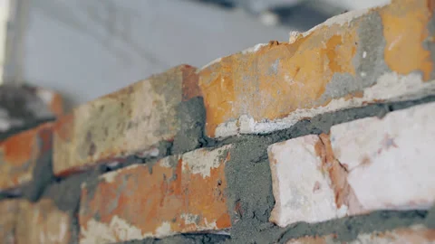A construction worker performs masonry work. Stock Footage 242187514