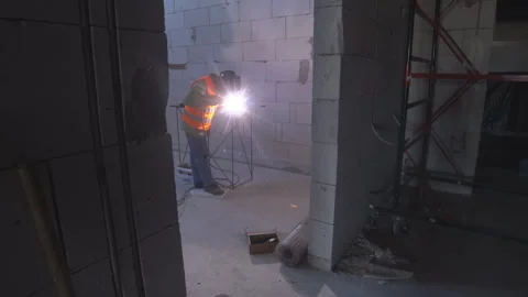 Construction worker performs welding work Stock Footage 260644257
