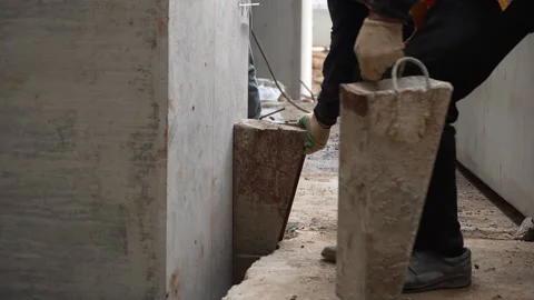 Construction worker placing column stopper on building site Stock Footage 315959777