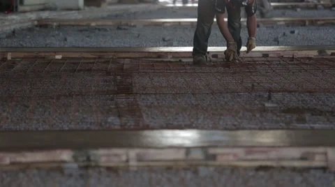Construction worker placing metal grid Stock Footage 63917257