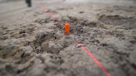 Construction worker placing plastic anchor into concrete floor Stock Photos