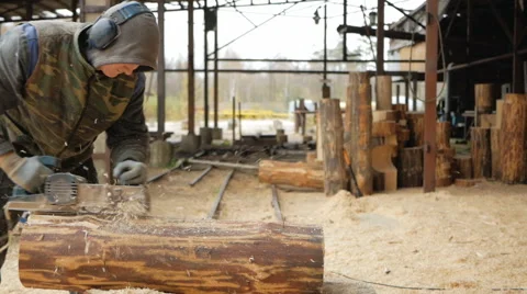 Construction worker planing a piece of wood for a building project. Construction Stock Footage 69002276