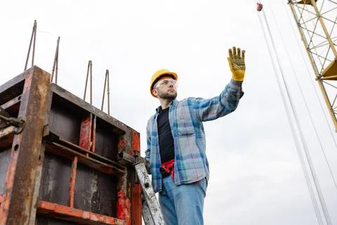 Construction worker planning building structure at site Stock Photos