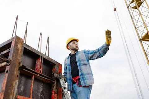 Construction worker planning building structure at site Stock Photos