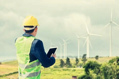 Construction Worker Planning Contractor Checking  at wind turbine constructio Stock Photos