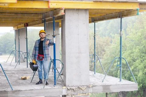 Construction worker planning project on building site Stock Photos