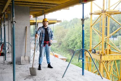 Construction worker planning project on building site Stock Photos