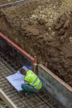 Construction worker with plans Stock Photos