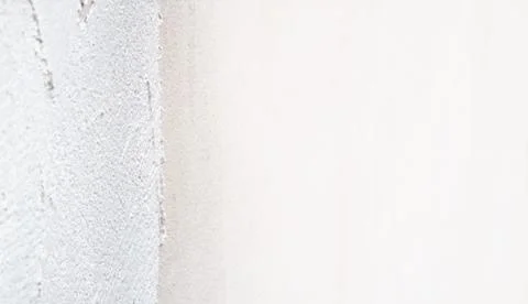Construction worker plastering and smoothing concrete wall with cement Stock Photos