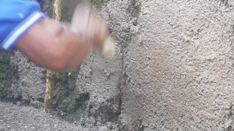 A construction worker is plastering a wall Stock Footage 333343646