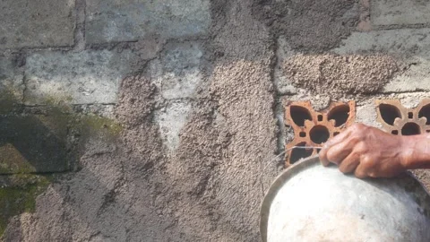 A construction worker is plastering a wall Stock Footage 333343668