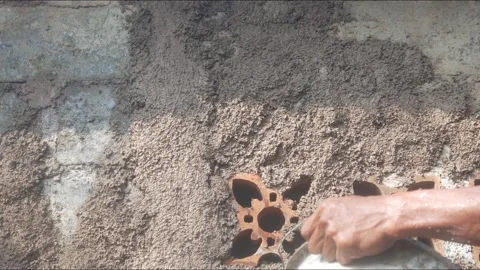 A construction worker is plastering a wall Stock Footage 333343685
