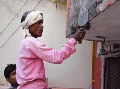 Construction Worker plastering a wall Foto stock