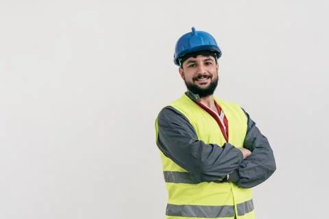 Construction worker portrait on white wall posing Stock Photos