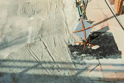 Construction worker pouring concrete on a building site Stock Photos