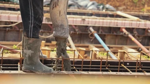 Construction worker pouring concrete foundation with pump Stock Footage 341294539