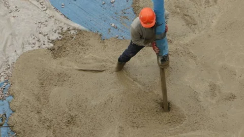 Construction Worker Pouring concrete mortar Stock Footage 122283363