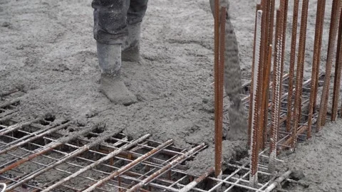 Construction Worker Pouring Fresh Concrete on Stock Footage 313730265