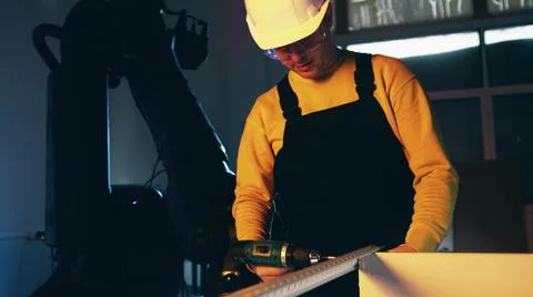 Construction worker with a power screwdriver Stock Photos