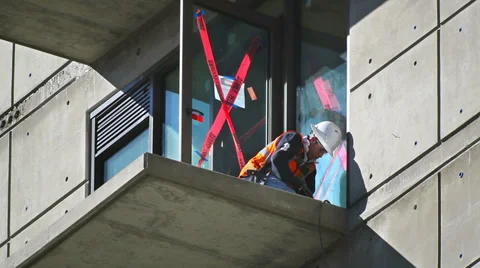 Construction worker prepares balcony floor for installation at development site Vídeo Stock 34138161