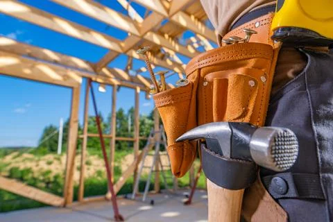 Construction Worker Prepares for Carpentry Task at Outdoor Site During Day Stock Photos