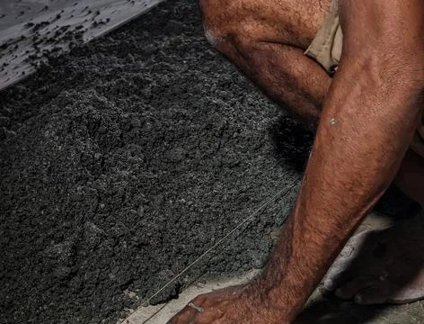 Construction Worker Preparing Concrete Material at Building Sites Stock Photos