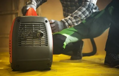 Construction Worker Preparing Gasoline Electricity Generator To Work Stock Photos