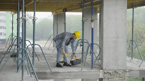 Construction worker preparing his toolbox on site Stock Footage 337466661