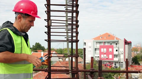 Construction Worker Preparing Steel Bars to Reinforce Concrete Stock Footage 34161301