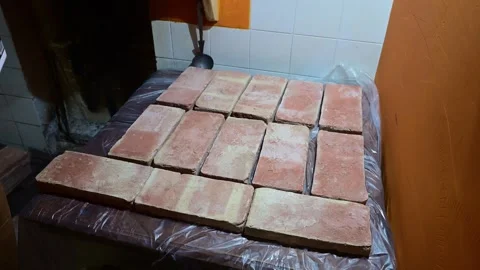 Construction worker preparing terracotta bricks for tiling Stock-Footage 346167890