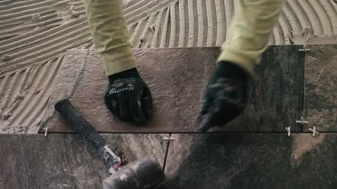 Construction worker preparing the tiles for the grounting. Stock Footage 288663442