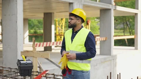 Construction worker preparing for work on site Stock Footage 343450926
