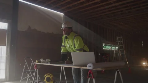 Construction Worker Processing While Writing At Desk Stock Footage 270388721