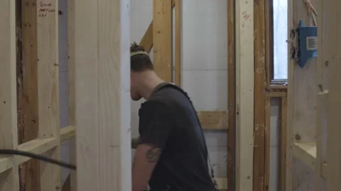 Construction worker is pulling a cable Stock Footage 144292994