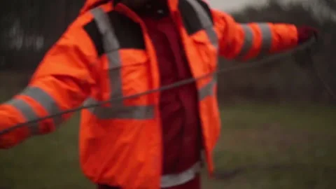 Construction worker pulling s steel cable. Stock Footage 226521034