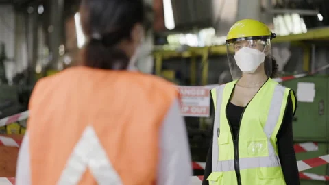 Construction worker put on face mask and Face Shield used body temperature Stock Footage 146789498