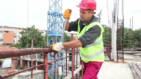 Construction Worker With Ratchet Wrench in Action Stock Footage 31861712