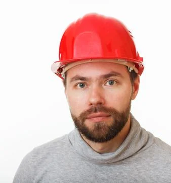 Construction worker in a red helmet. Stock Photos