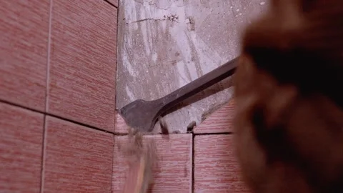 Construction worker removing tiles using jackhammer Stock Footage 297461943