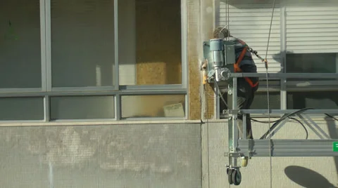 Construction worker repairing the building Stock Footage 30320276