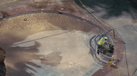 Construction worker repairing pool, 4K Stock Footage 46969156