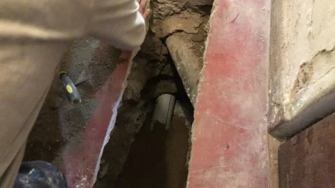 Construction worker repairing underground sewage pipe Stock Footage 337672835