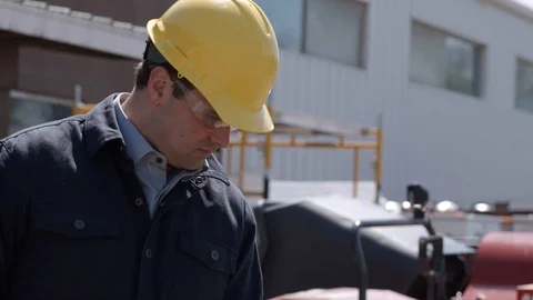 Construction worker rinsing off  ground Stock Footage 88961124