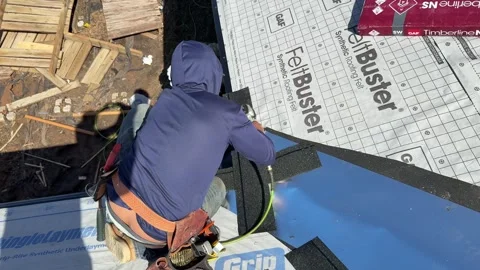 Construction Worker on Roof with Shingles Video stock 304006181