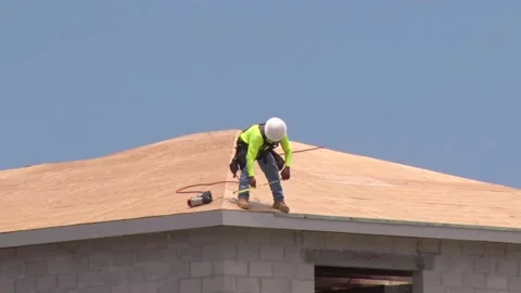 Construction Worker On Roof Using Measuring Tape Stock Footage 200882486