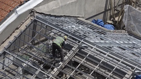 Construction Worker On Rooftop Building Zoom Out Video stock 91381607