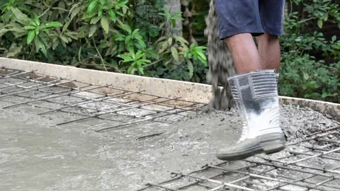 Construction Worker in Rubber Boots Walking on Rebar Steel Mesh Grid Close Up. Stock Footage 337850393