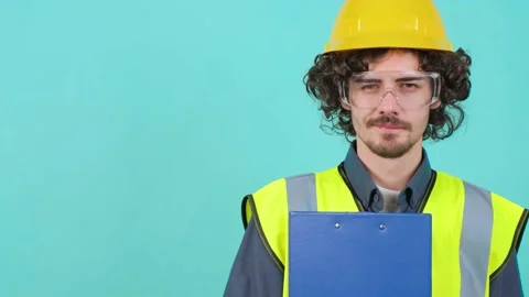 Construction worker with safety glasses and helmet that is looking at camera. Stock Footage 151545920