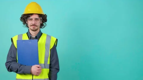 Construction worker with safety glasses and helmet that is looking at camera. Stock Footage 155650668